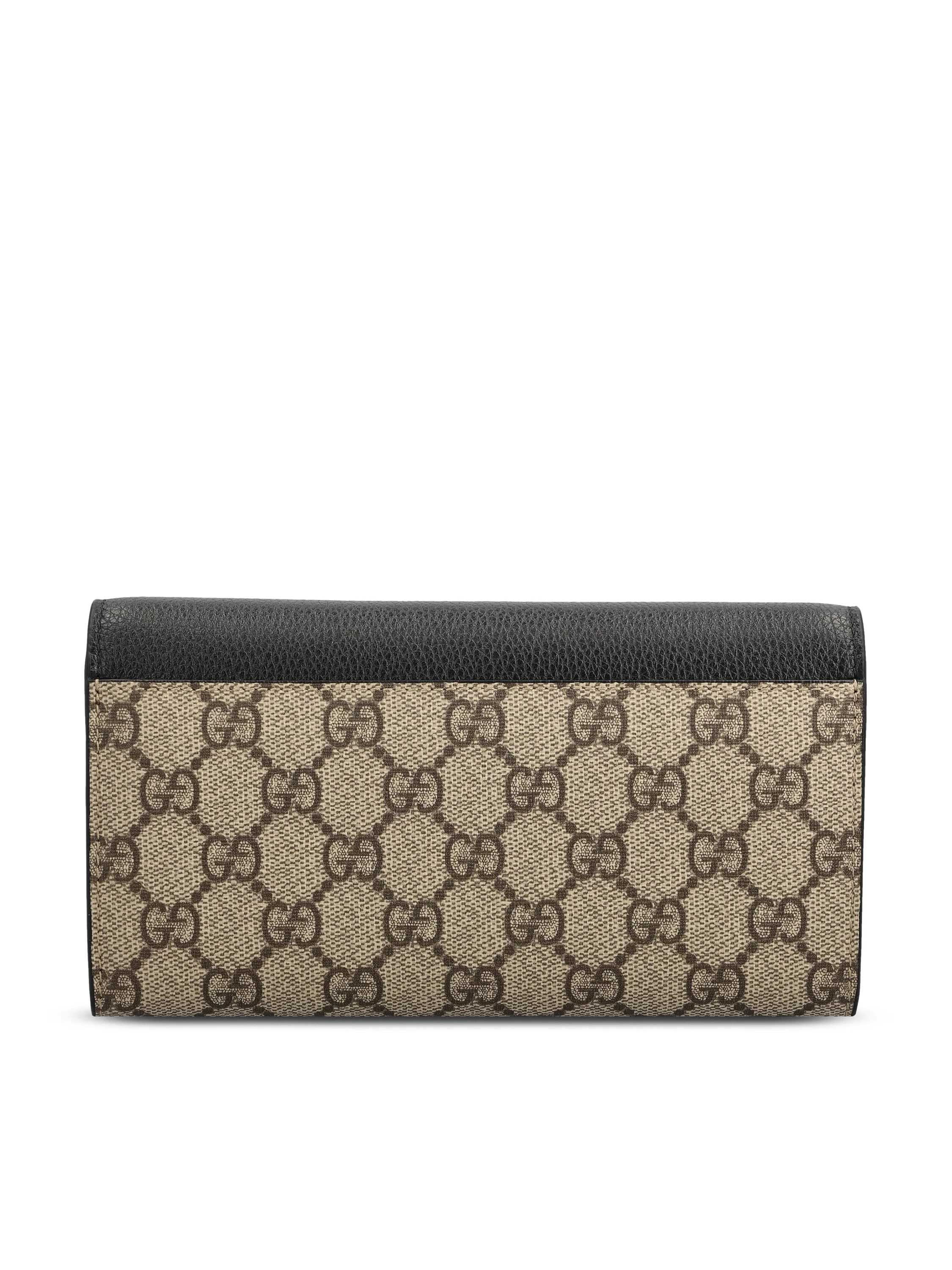 Portafoglio realizzato in pelle e tessuto. 456116 AAE5E1069 GUCCI 
